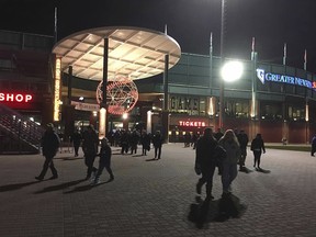 In this April 11, 2017 photo, fans walk outside Greater Nevada Field during last year's opening game for the Reno Aces minor league baseball team in Reno, Nev. (AP Photo/Scott Sonner)