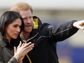 Britain's Prince Harry and his fiancee Meghan Markle attend the UK team trials for the Invictus Games Sydney 2018 at the University of Bath in Bath, England, Friday, April 6, 2018. The Invictus Games is the only international sport event for wounded, injured and sick (WIS) servicemen and women, both serving and veteran. The Invictus Games Sydney 2018 will take place from 20-27th October and will see over 500 competitors from 18 nations compete in 11 adaptive sports.
