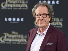 FILE - In this May 18, 2017, file photo, Geoffrey Rush arrives at the Los Angeles premiere of "Pirates of the Caribbean: Dead Men Tell No Tales" at the Dolby Theatre. Oscar-winning actor Rush has become virtually housebound, barely eats and wakes each morning with a "terrible sense of dread" since a Sydney newspaper alleged inappropriate behavior toward an actress, his lawyer swore in an affidavit. Lawyer Nicholas Pullen's affidavit submitted to the Australian Federal Court in Sydney on Monday, April 9, 2018, said the 66-year-old Australian actor had suffered "tremendous emotional and social hardship" since The Daily Telegraph accused him in December of inappropriate behavior toward actress Eryn Jean Norvill during the Sydney Theatre Company's production of "King Lear" in 2015.