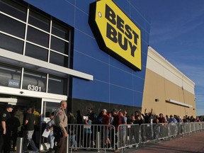 This photo taken Nov. 23, 2017, shows holiday shoppers pouring into Best Buy to get an early start to the Black Friday sale at Chimney Rock Shopping Center, in Odessa, Texas.