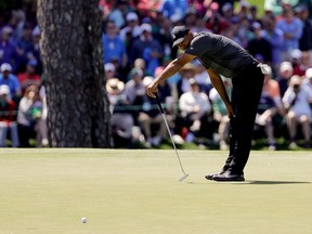 Tiger Woods misses a birdie putt on the 15th hole during the first round at the Masters on April 5, 2018
