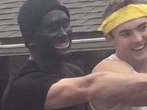 A photo posted on Facebook shows a California Polytechnic State University student in blackface posing for a photo at a fraternity event. (Facebook)
