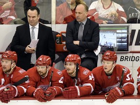 Detroit Red Wings head coach Jeff Blashill, middle background, watches his team play against the Ottawa Senators Monday, April 3, 2017, in Detroit. (AP Photo/Jose Juarez)