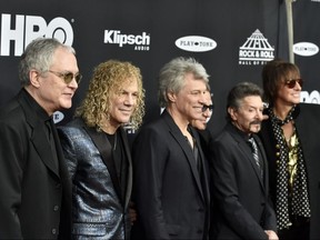 Members of Bon Jovi arrive at the red carpet before the Rock & Roll Hall of Fame induction ceremony in Cleveland, Saturday, April 14, 2018. (David Richard/AP Photo)