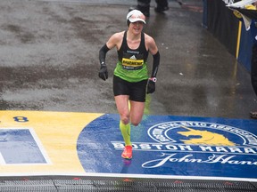 Krista Duchene of Canada crosses the finish line in third place during the Boston Marathon Monday, April 16, 2018 in Boston. (Getty Images)