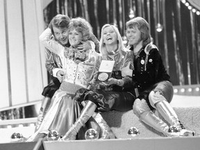 FILE - In this April 6, 1974 file photo, Swedish pop group ABBA celebrate winning the 1974 Eurovision Song Contest on stage at the Brighton Dome in England with their song Waterloo. From left, Benny Andersson, Anni-Frid Lyngstad (Frida), Agentha Faltskog, and Bjorn Ulvaeus. The members of ABBA announced on Friday April 27, 2018, they have recorded new material for the first time in 35 years.