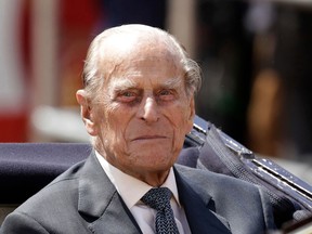 In this file photo dated Wednesday, July 12, 2017,  Prince Philip sits in a carriage in London.