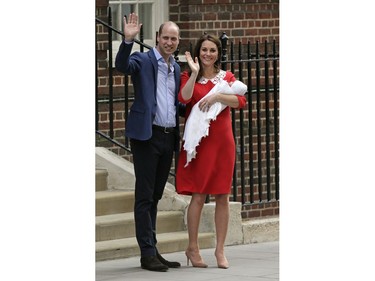 Britain's Prince William and Kate, Duchess of Cambridge wave as they hold their newborn baby son as they leave the Lindo wing at St Mary's Hospital in London London, Monday, April 23, 2018. The Duchess of Cambridge gave birth Monday to a healthy baby boy -- a third child for Kate and Prince William and fifth in line to the British throne.
