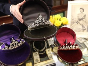 In this photo taken on Thursday, April 5, 2018 diamond tiaras are displayed at Bradley & Skinner an antique & period jewellery specialist in London. Will she or won't she _ wear a tiara? Meghan Markle will have access to one of the world's most remarkable jewelry collections for her wedding to Prince Harry. Queen Elizabeth II, Harry's grandmother, has hundreds of jeweled tiaras sparkling away in locked vaults covered with diamonds _ to say nothing of rubies, sapphires and emeralds. London jewelers are hoping Markle will bring tiaras back in fashion when she walks down the aisle May 19 at Windsor Castle.