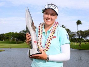 Brooke Henderson poses with the trophy after a four shot victory in the LPGA LOTTE Championship at the Ko Olina Golf Club on Saturday, April 14, 2018 in Kapolei, Hawaii. (Harry How/Getty Images)