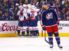 Alex Ovechkin of the Washington Capitals is congratulated by his teammates after scoring a goal during Game 6 at Nationwide Arena on April 23, 2018