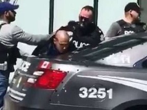 Toronto Police make an arrest after Monday's van attack.