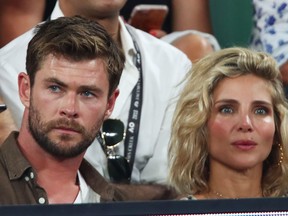 Chris Hemsworth and his wife Elsa Pataky watch the Men's singles final match between Roger Federer of Switzerland and Marin Cilic of Croatia on day 14 of the 2018 Australian Open at Melbourne Park on January 28, 2018 in Melbourne, Australia.  (Clive Brunskill/Getty Images)
