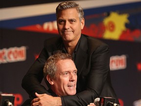 Hugh Laurie (bottom) and George Clooney attend Walt Disney Studios' 2014 New York Comic Con presentation of "Tomorrowland" at the Javits Convention Center on Thursday Oct. 9, 2014 in New York City. (Jason Carter Rinaldi/Getty Images for Disney)