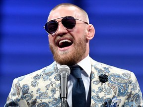In this August 26, 2017 file photo, Conor McGregor speaks to the media after losing to Floyd Mayweather Jr. by 10th round TKO in their super welterweight boxing match at T-Mobile Arena in Las Vegas