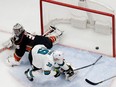 San Jose Sharks centre Logan Couture, right, scores past Anaheim Ducks goaltender John Gibson during the first period of Game 2 of an NHL hockey first-round playoff series in Anaheim, Calif., Saturday, April 14, 2018. (AP Photo/Chris Carlson)