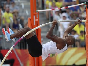 Canadian decathlete Damian Warner competes in the pole vault at Carrara Stadium during the Commonwealth Games Tuesday, April 10, 2018. (AP Photo/Dita Alangkara)