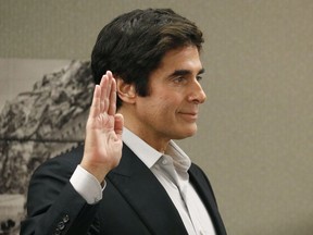 Illusionist David Copperfield is sworn in during court Wednesday, April 18, 2018, in Las Vegas. Copperfield testified in a negligence lawsuit involving a British man who claims he was badly hurt when he fell while participating in a 2013 Las Vegas show.
