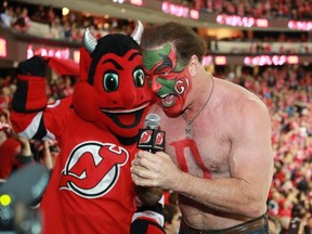 Patrick Warburton, the actor who played David Puddy on "Seinfeld" and wore makeup supporting the New Jersey Devils during an episode of the show attends Game 4 of an NHL first-round hockey playoff series between the Devils and the Tampa Bay Lightning, Wednesday, April 18, 2018, in Newark, N.J.