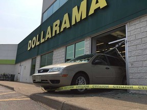 A vehicle that backed into the Dollarama at 5415 Tecumseh Rd. East in Windsor, Ont., on April 13, 2018. (Nick Brancaccio/POSTMEDIA)