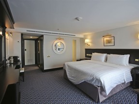 A duplex room is ready to receive guests aboard the Queen Elizabeth 2, moored off the Mideast city-state of Dubai, United Arab Emirates, Tuesday, April 17, 2018. Britain's famed luxury cruise ship finally will have a soft opening Wednesday as a floating luxury hotel nearly a decade after arriving here following her last ocean voyage.