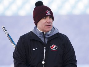 Canada's head coach Dominique Ducharme stands on the ice during their outdoor hockey practice at New Era Field during the IIHF World Junior Championship in Orchard Park, N.Y., on Dec. 28, 2017