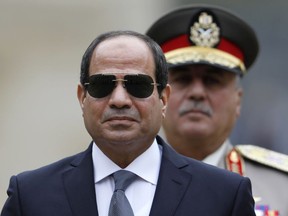 In this Oct. 24, 2017 file photo, Egyptian President Abdel-Fattah el-Sissi attends a military ceremony in the courtyard at the Hotel des Invalides in Paris, France.