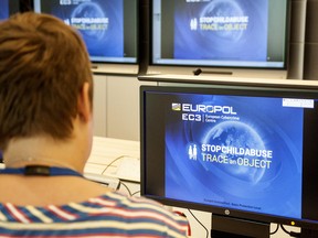 A Europol police agent looks at the onscreen logo of a new website launched by Europol at the Europol headquarters in The Hague on May 31, 2017.  (JAN HENNOP/AFP/Getty Images)