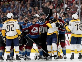 Gabriel Bourque of the Colorado Avalanche fights with Mattias Ekholm #14 of the Nashville Predators in Game Six of the Western Conference First Round during the 2018 NHL Stanley Cup Playoffs at the Pepsi Center on April 22, 2018 in Denver, Colorado.  (Matthew Stockman/Getty Images)