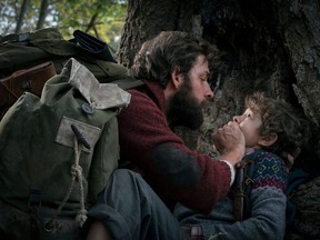 This image released by Paramount Pictures shows John Krasinski, left, and Noah Jupe in a scene from "A Quiet Place."