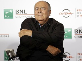 FILE - In this Oct. 15, 2016, file photo, director Bernardo Bertolucci poses for photographers during a photo call at the Rome Film festival in Rome.
