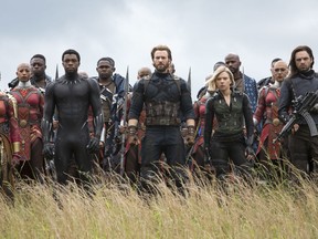 This image released by Marvel Studios shows, front row from left, Danai Gurira, Chadwick Boseman, Chris Evans, Scarlet Johansson and Sebastian Stan in a scene from "Avengers: Infinity War," premiering on April 27.