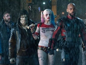 This image released by Warner Bros. Pictures shows, from left, Jai Courtney as Boomerang, Adewale Akinnuoye-Agbaje as Killer Croc, Margot Robbie as Harley Quinn, Will Smith as Deadshot,  in a scene from "Suicide Squad." (Clay Enos/Warner Bros. Pictures via AP)