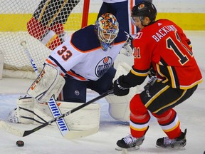 Mikael Backlund beats Cam Talbot as the host Flames score a 3-2 victory over the Oilers at the Saddledome on Saturday, March 31, 2018.
