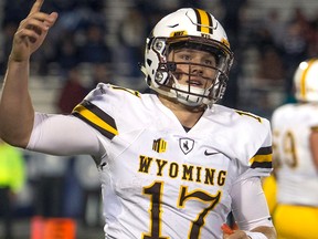 In this Oct. 22, 2016, file photo, Wyoming quarterback Josh Allen reacts after scoring a touchdown in the second half of an NCAA college football game against Nevada in Reno, Nev.