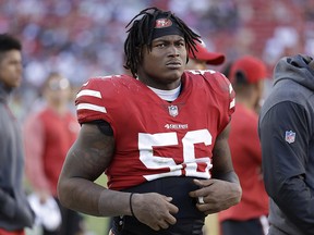 In this Oct. 22, 2017, file photo, San Francisco 49ers linebacker Reuben Foster (56) stands on the sideline during a game against the Dallas Cowboys in Santa Clara, Calif. (AP Photo/Marcio Jose Sanchez, File)