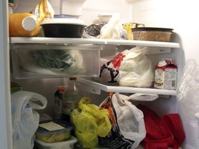The inside of a refrigerator in an office kitchen is seen in New York, Tuesday, July 1, 2008. In the realm of office politics, nothing stirs up conflict quite like the office fridge, a cold war waged with passive aggressive Post-It notes and decomposing leftovers.