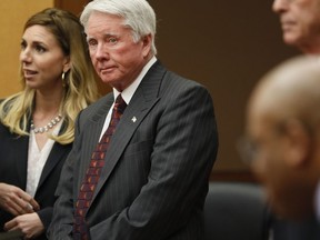 Claud "Tex" McIver stands as court went into session as the jury resumed deliberations in his murder trial at the Fulton County Courthouse, Monday, April 23, 2018, in Atlanta. McIver was later found guilty. (Bob Andres/Atlanta Journal-Constitution via AP/Pool)