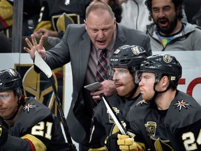 Vegas Golden Knights coach Gerard Gallant speaks with players during an NHL game against the Chicago Blackhawks on Feb. 13, 2018