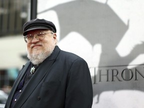 In this March 18, 2013 file photo, author George R.R. Martin arrives at the premiere for the third season of the HBO television series "Game of Thrones" at the TCL Chinese Theatre in Los Angeles. (Photo by Matt Sayles /Invision/AP, File)