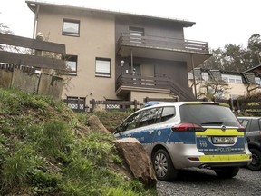 A police car stands in front of a house in Bad Koenig, Germany, Tuesday, April 10, 2018. Police say a seven-month-old infant has died in that house after being bitten in the head by the family's dog in southern Germany. Police in Hesse state said Tuesday that it's unclear why the dog attacked the child. The dog has been taken to an animal shelter. The incident in Bad Koenig, about 45 kilometers (28 miles) southeast of Frankfurt, took place almost a week after two people were killed by a dog in northern Germany. (Fabian Sommer/dpa via AP) ORG XMIT: XBK101