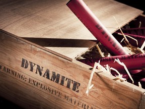 In this stock photo, sticks of dynamite sit in a wooden box.