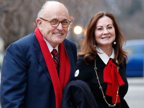 In a Friday, Jan. 20, 2017 file photo, Rudy and Judith Giuliani, arrive for a church service at St. John's Episcopal Church across from the White House in Washington, on Donald Trump's inauguration day. (AP Photo/Alex Brandon, File)