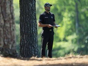 Adam Hadwin of Canada prepares to play a shot on the 14th hole during the first round of the Masters at Augusta National Golf Club on April 5, 2018