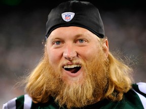 In this Sept. 1, 2011, file photo, New York Jets' Nick Mangold looks on during the fourth quarter of an NFL preseason football game against the Philadelphia Eagles in East Rutherford, N.J.