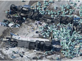 The wreckage visible Saturday after a bus carrying the Humboldt Broncos hockey team and a tractor-trailer collided outside of Tisdale, Sask.