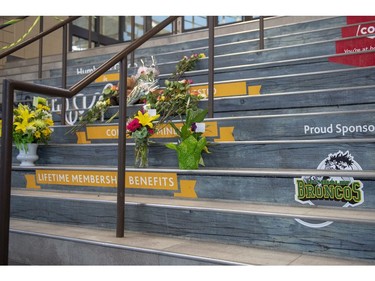 A memorial of flowers and cards sits on the stairs leading into Elgar Petersen Arena, home of the Humboldt Broncos hockey team, in Humboldt, Sask., on Saturday, April 7, 2018. RCMP say 14 people are dead and 14 people were injured Friday after a truck collided with a bus carrying a junior hockey team to a playoff game in northeastern Saskatchewan. Police say there were 28 people including the driver on board the Humboldt Broncos bus when the crash occurred at around 5 p.m. on Highway 35 north of Tisdale.