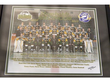 A team photo of the 2016/2017 Humboldt Broncos hockey team hangs in Elgar Petersen Arena in Humboldt, Sask., on Saturday, April 7, 2018. RCMP say 14 people are dead and 14 people were injured Friday after a truck collided with a bus carrying a junior hockey team to a playoff game in northeastern Saskatchewan. Police say there were 28 people including the driver on board the Humboldt Broncos bus when the crash occurred at around 5 p.m. on Highway 35 north of Tisdale.