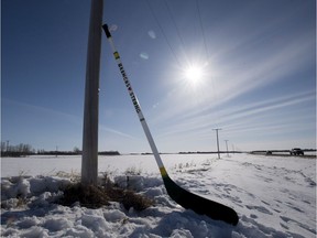 A giant hockey stick remembering the Humboldt Broncos stands against a telephone pole just outside of Humboldt, Sk., Friday, April, 13, 2018. THE CANADIAN PRESS/Jonathan Hayward