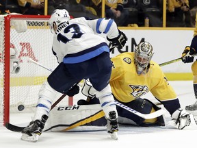 Winnipeg Jets left wing Brandon Tanev (13) scores a goal against Nashville Predators goalie Pekka Rinne (35), during the first period in Game 1 of an NHL hockey second-round playoff series Friday(AP Photo/Mark Humphrey).